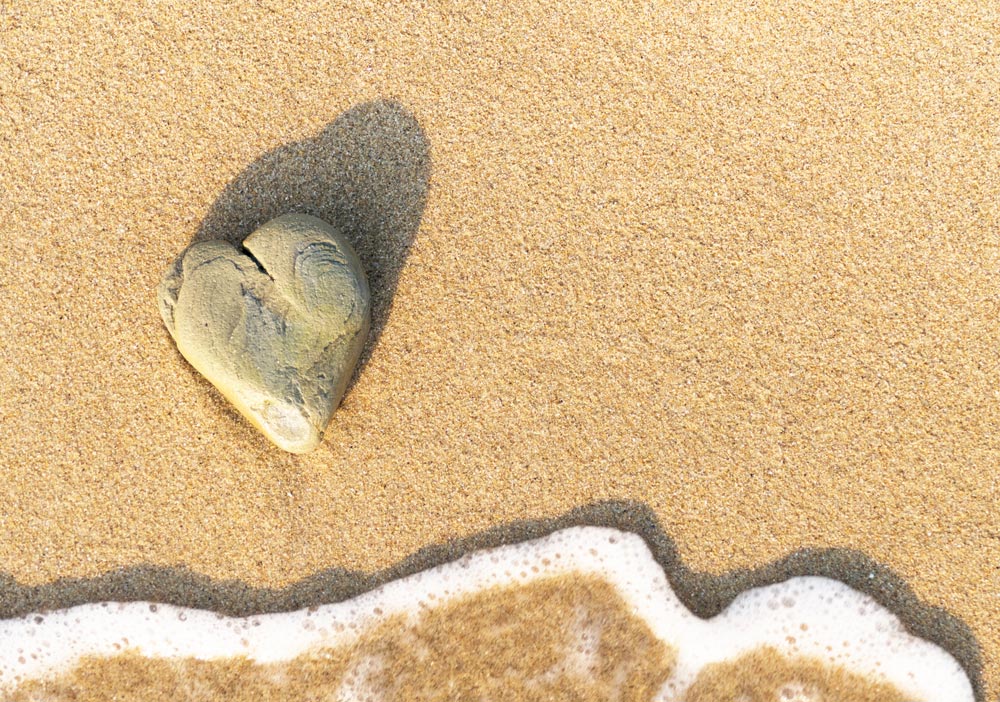 heart made of a rock on a beach